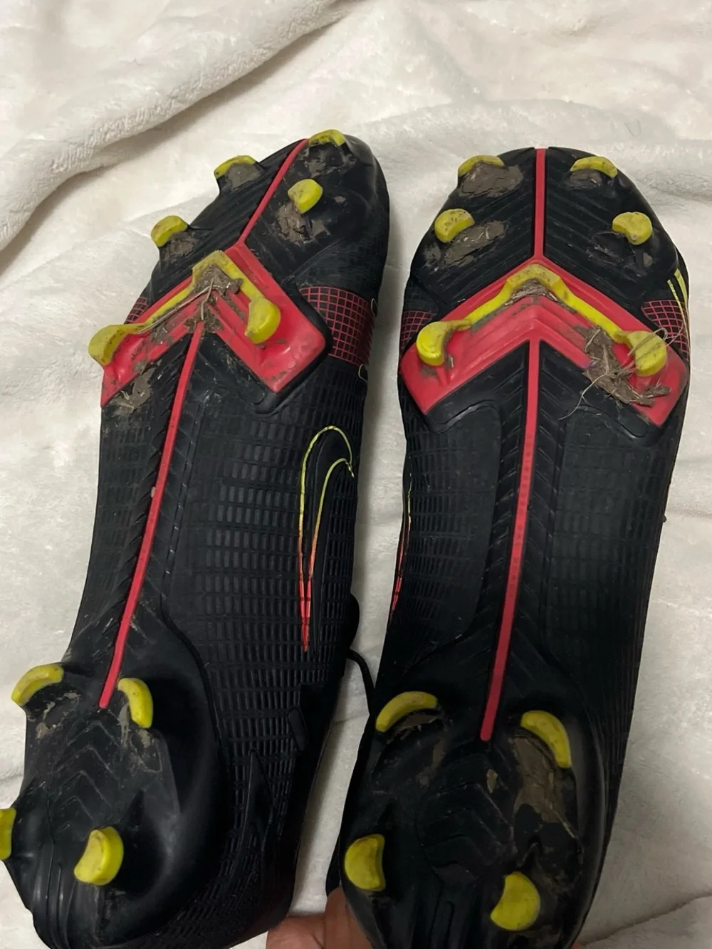 Nike Men's Black Soccer Cleats with Yellow and Red Accents